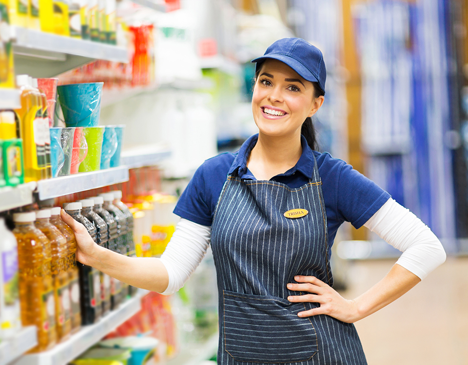 supermarket saleswoman standing in store